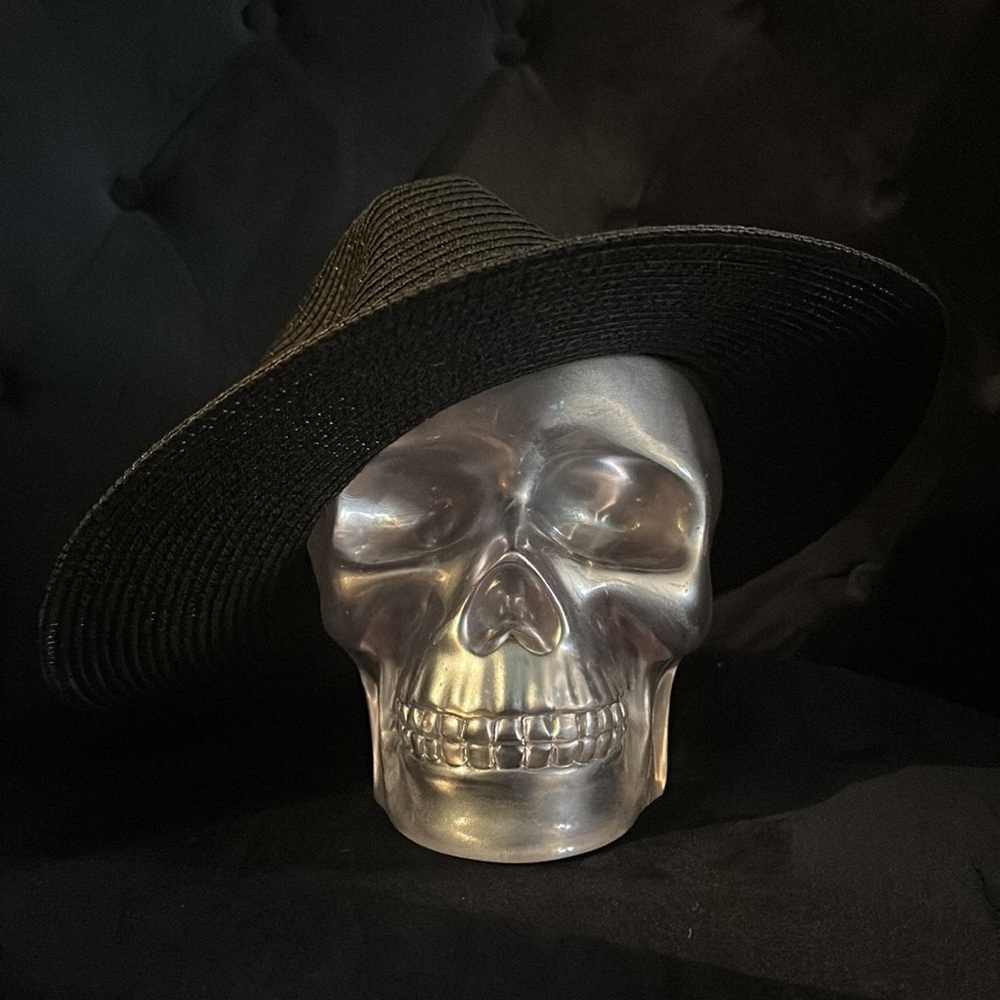 Black gorgeous hat with a thick black ribbon…never worn. No damage.